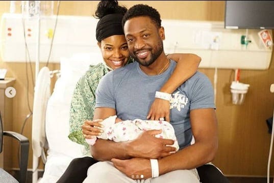 Gabrielle Union com o marido e a bebê