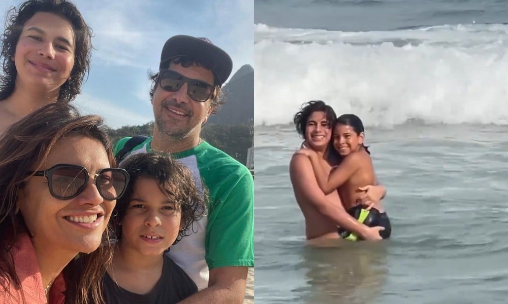 Dira Paes posa com seus filhos e o marido na praia