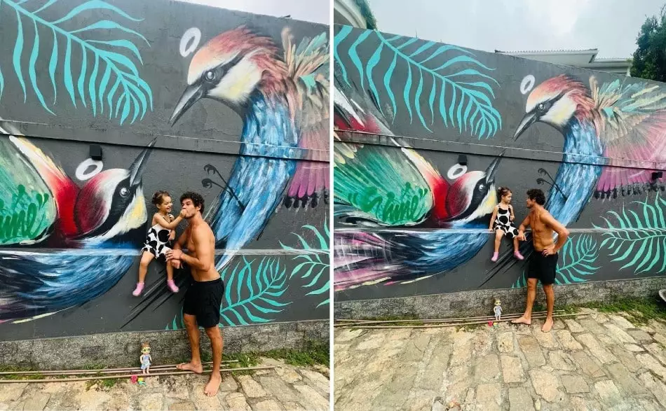José Loreto com a filha Bella em frente um colorido mural