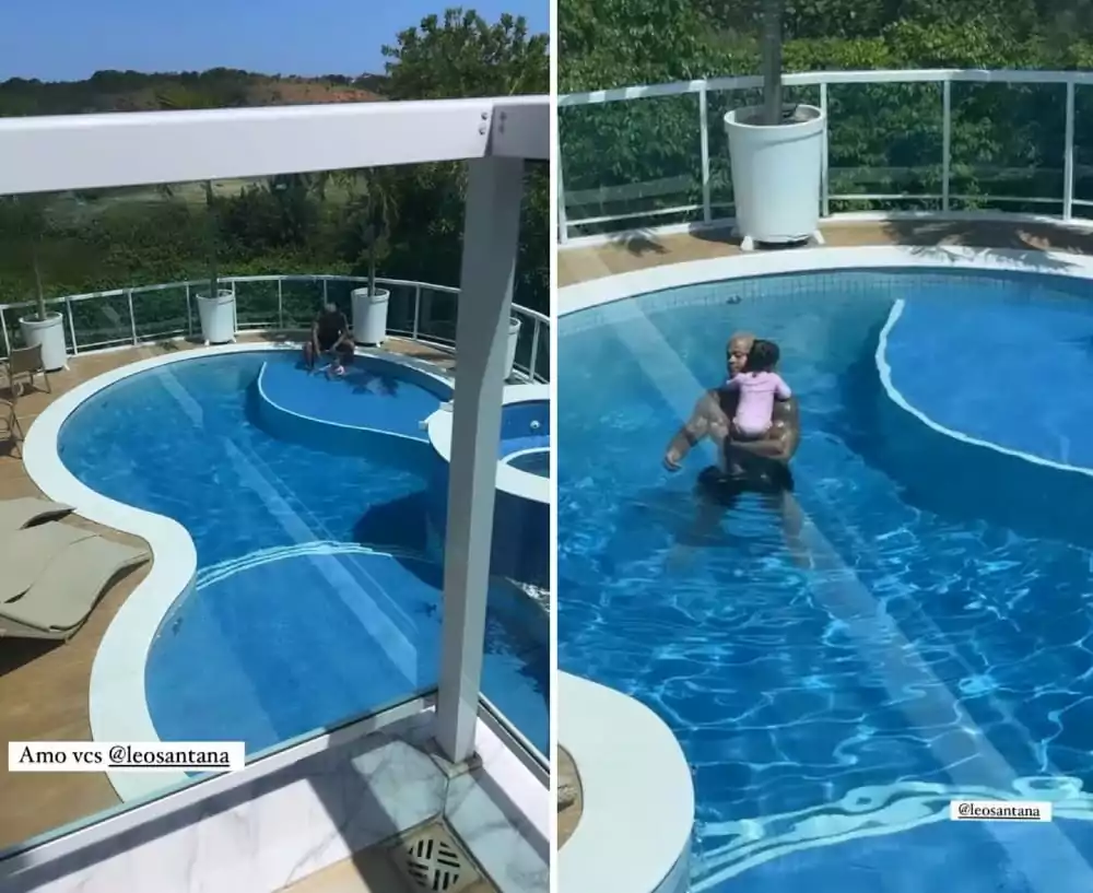 Léo Santana brincando com a filha na piscina gigantesca da mansão 