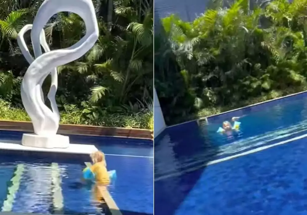Afilhada de Xuxa Meneghel na piscina da casa dela