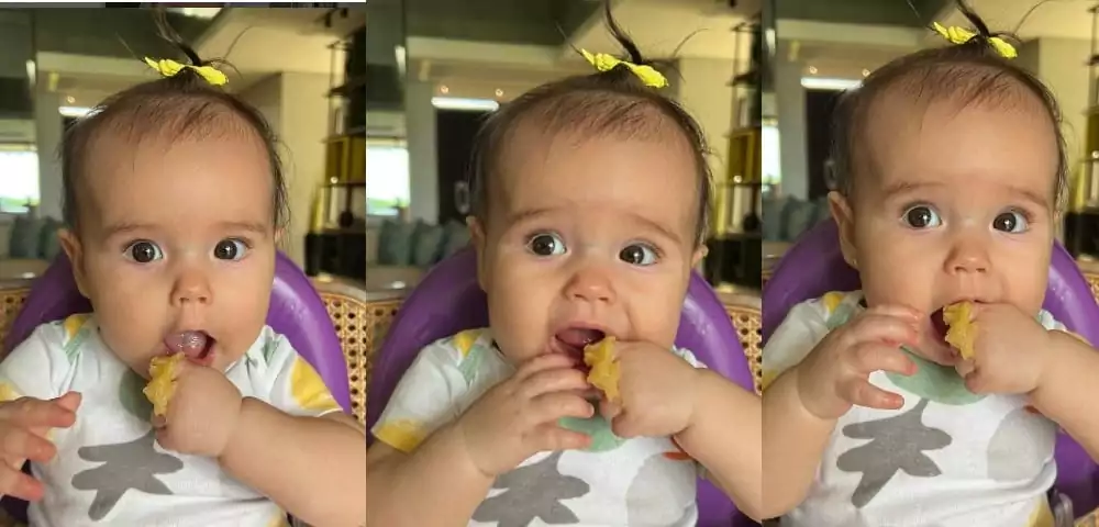 Bebê de Mano Walter surge comendo pela primeira vez