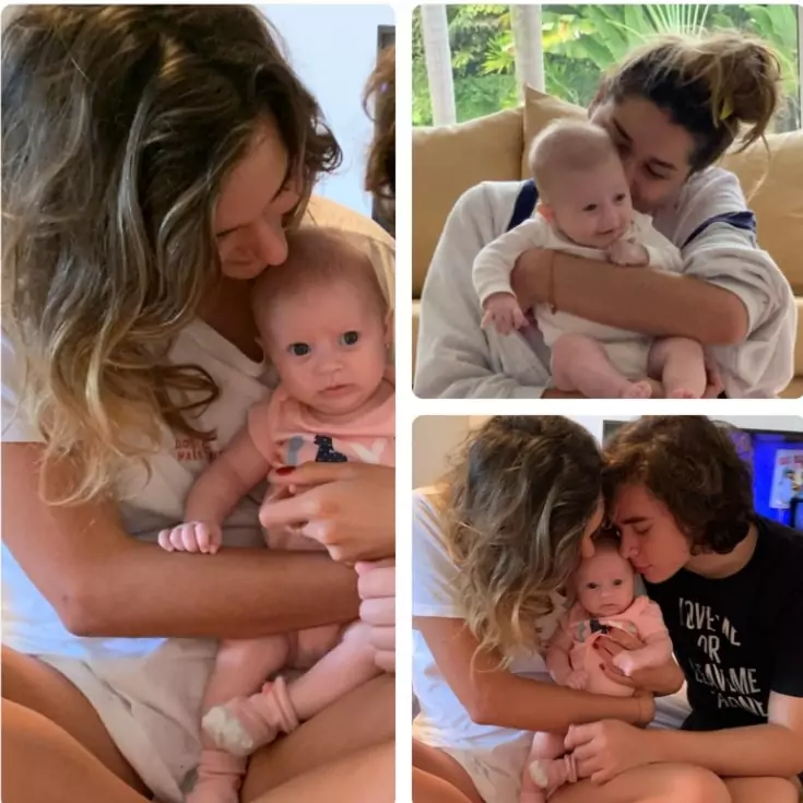 Sasha junto com o marido e uma bebê